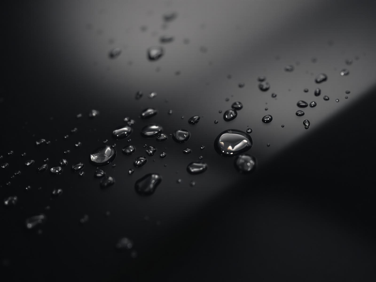 Water beading on glossy ceramic-coated car paint